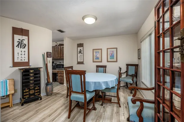 a view of a livingroom with furniture and wooden floor