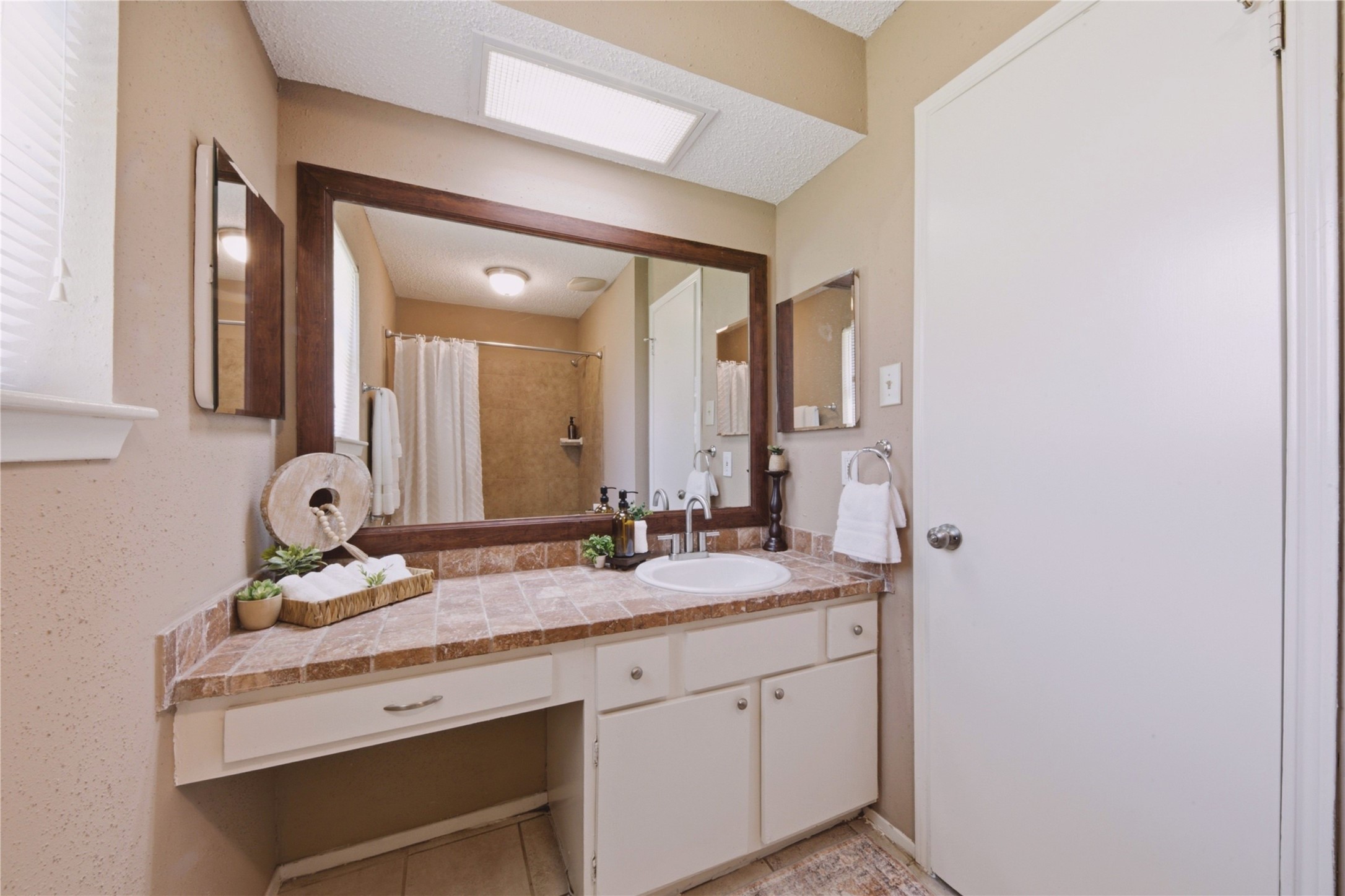 4019 Postwood Drive Spring, TX 77388 - Photo 26 of 50 a bathroom with a sink and a mirror