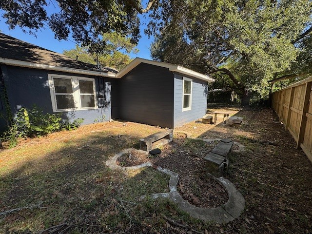 1616 North Travis Street Liberty, TX 77575 - Photo 13 of 23 a front view of house with yard and trees in the background