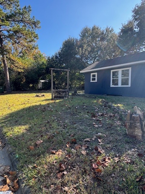 1616 North Travis Street Liberty, TX 77575 - Photo 14 of 23 a view of a house with a yard