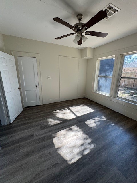 1616 North Travis Street Liberty, TX 77575 - Photo 20 of 23 a view of empty room with wooden floor and fan