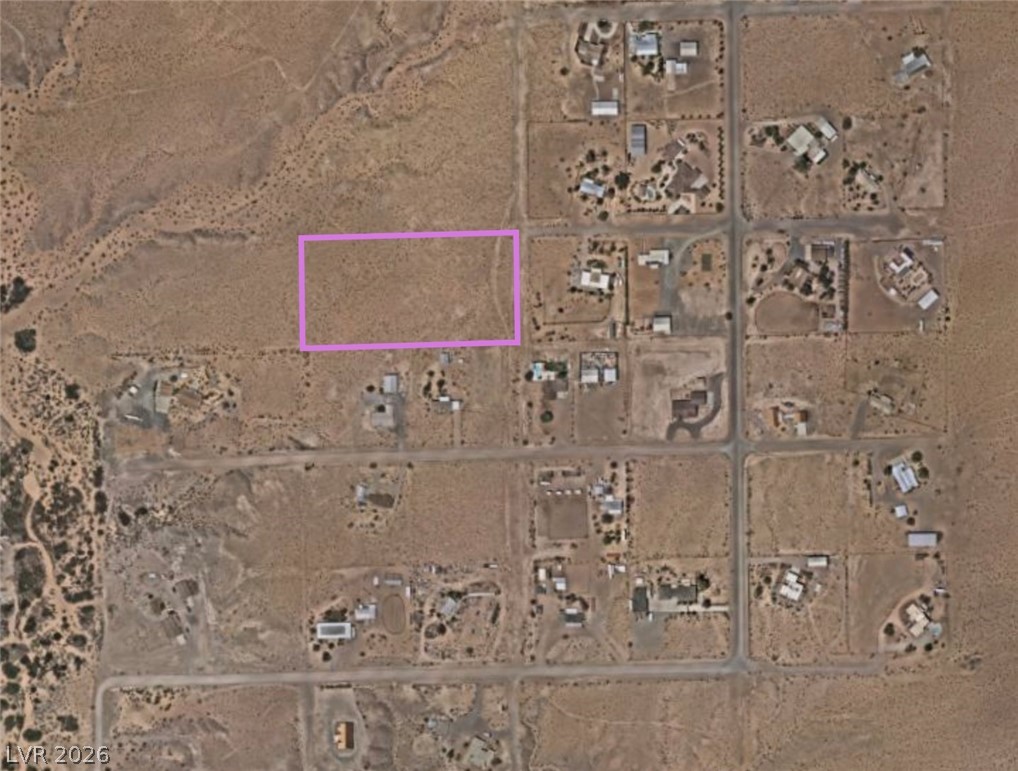 North Ishimoto Overton, NV 89040 - Photo 2 of 10 Uncover this vast, undeveloped land parcel amidst a serene, expansive landscape.