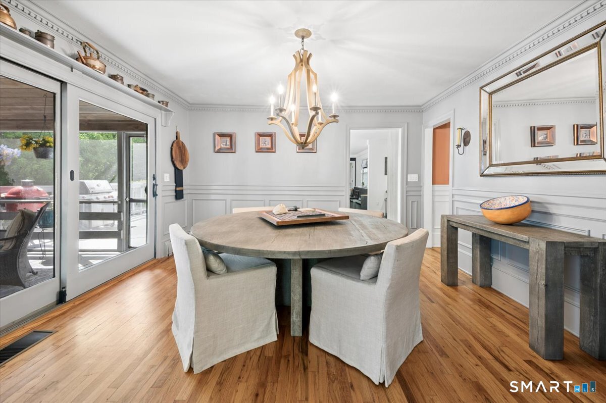 94 Vista Road Wilton, CT 06897 - Photo 8 of 38 a view of a dining room with furniture window and wooden floor