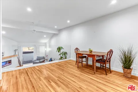 a dining room with a table and chairs