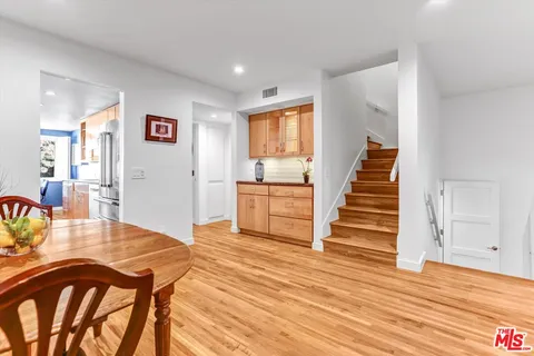 a livingroom with wooden floor and furniture