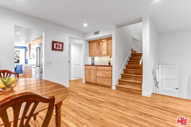 a livingroom with wooden floor and furniture
