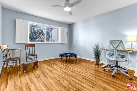 a view of a livingroom with furniture and a table