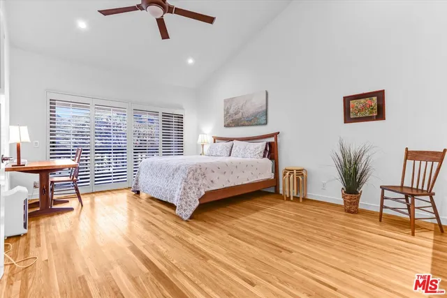 a bedroom with a bed and a table