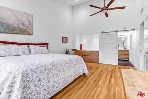 a bedroom with a bed and a view of bathroom