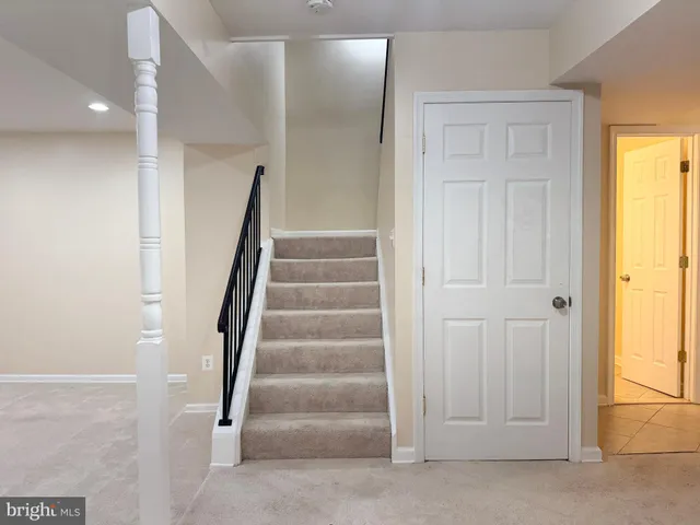 a view of staircase with white walls and white walls