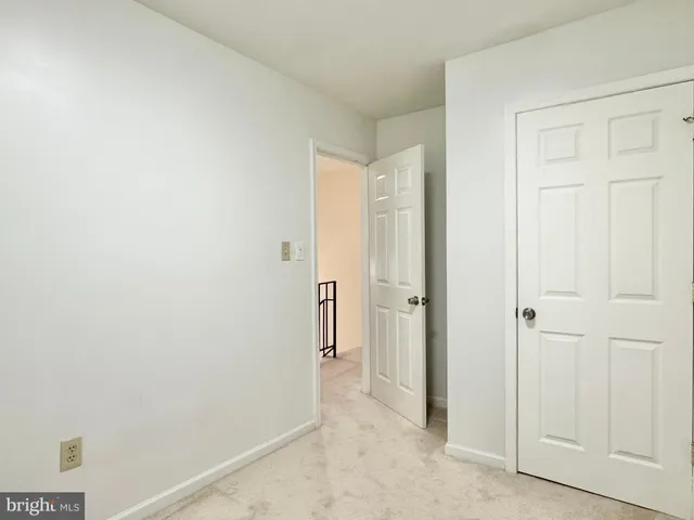 a view of a hallway with closet area