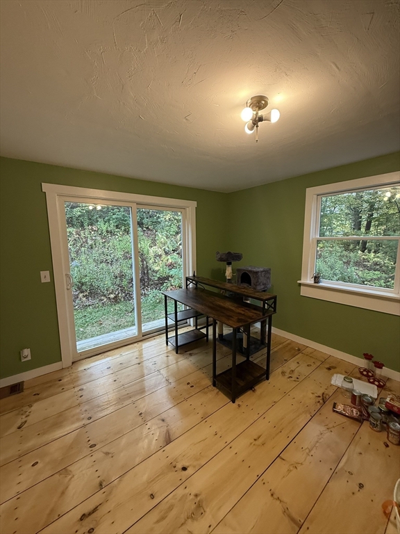 137 Deer Bay Road Ashby, MA 01431 - Photo 7 of 21 a living room with furniture and a large window