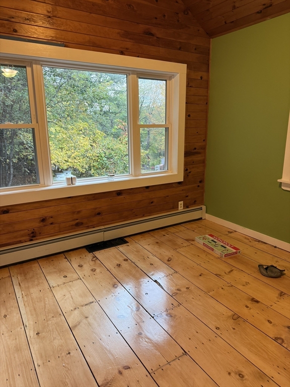 137 Deer Bay Road Ashby, MA 01431 - Photo 10 of 21 a view of a room with wooden floor and iron stairs