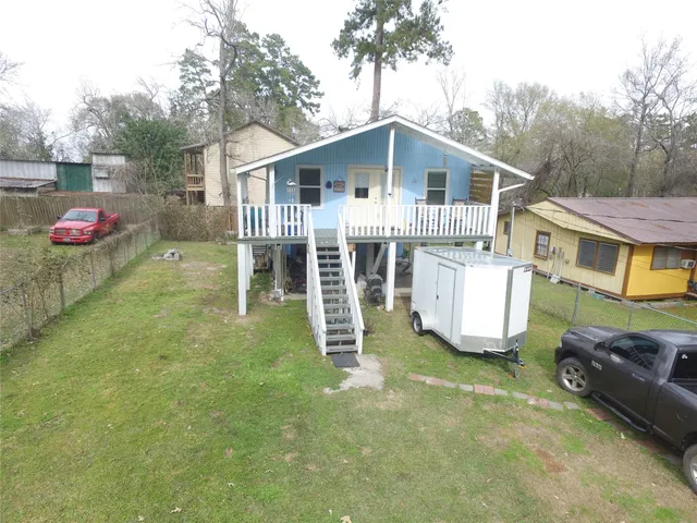 a white house that has a sink and garden