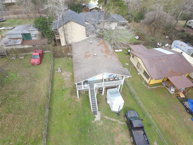 an aerial view of a house with outdoor space