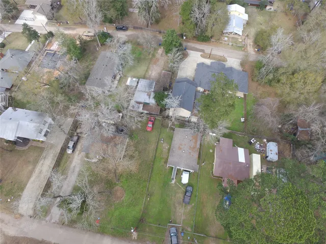an aerial view of residential houses with outdoor space