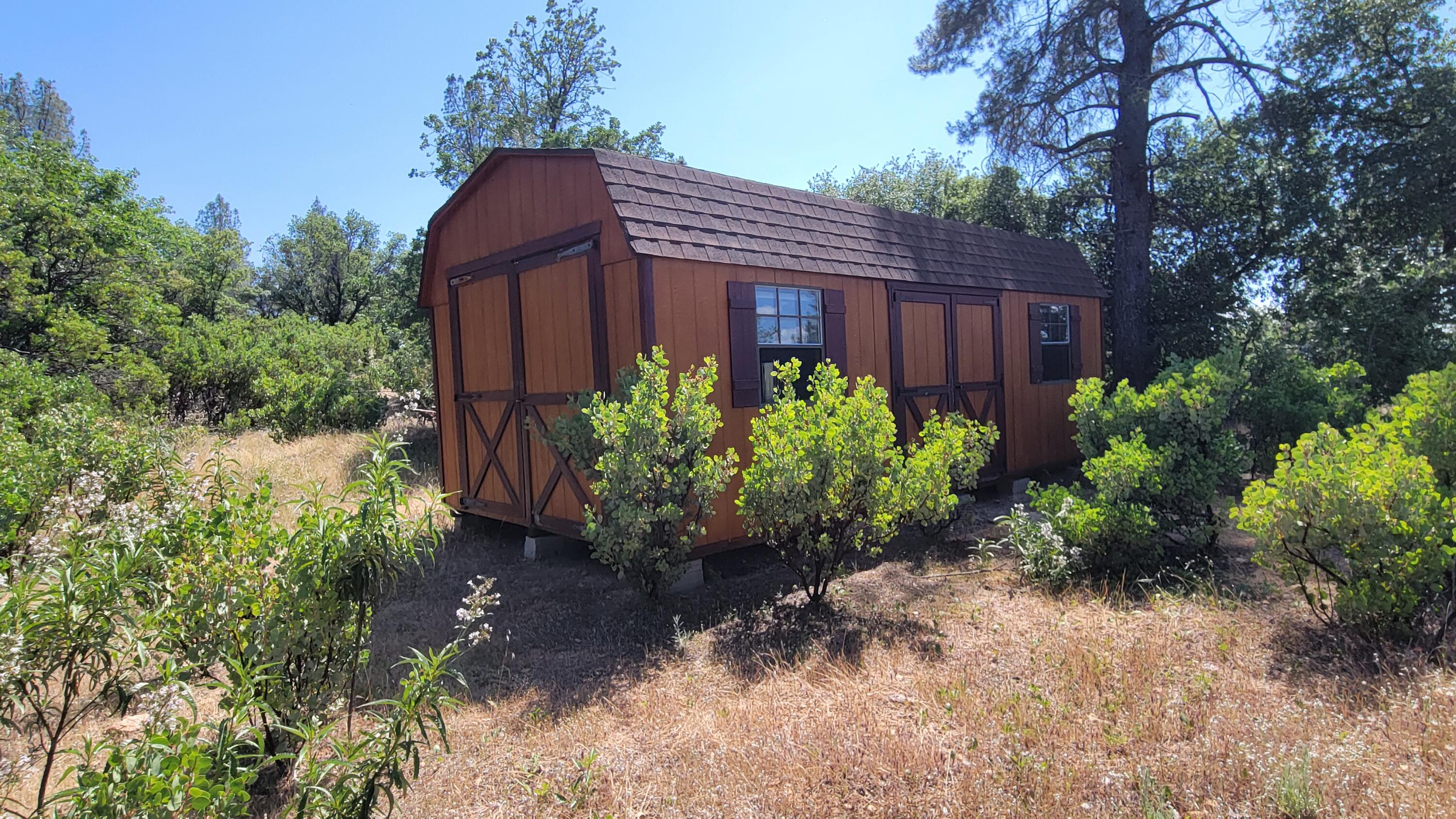 0 Backbone Road Bella Vista, CA 96008 - Photo 15 of 38 a view of a house with a yard and plants