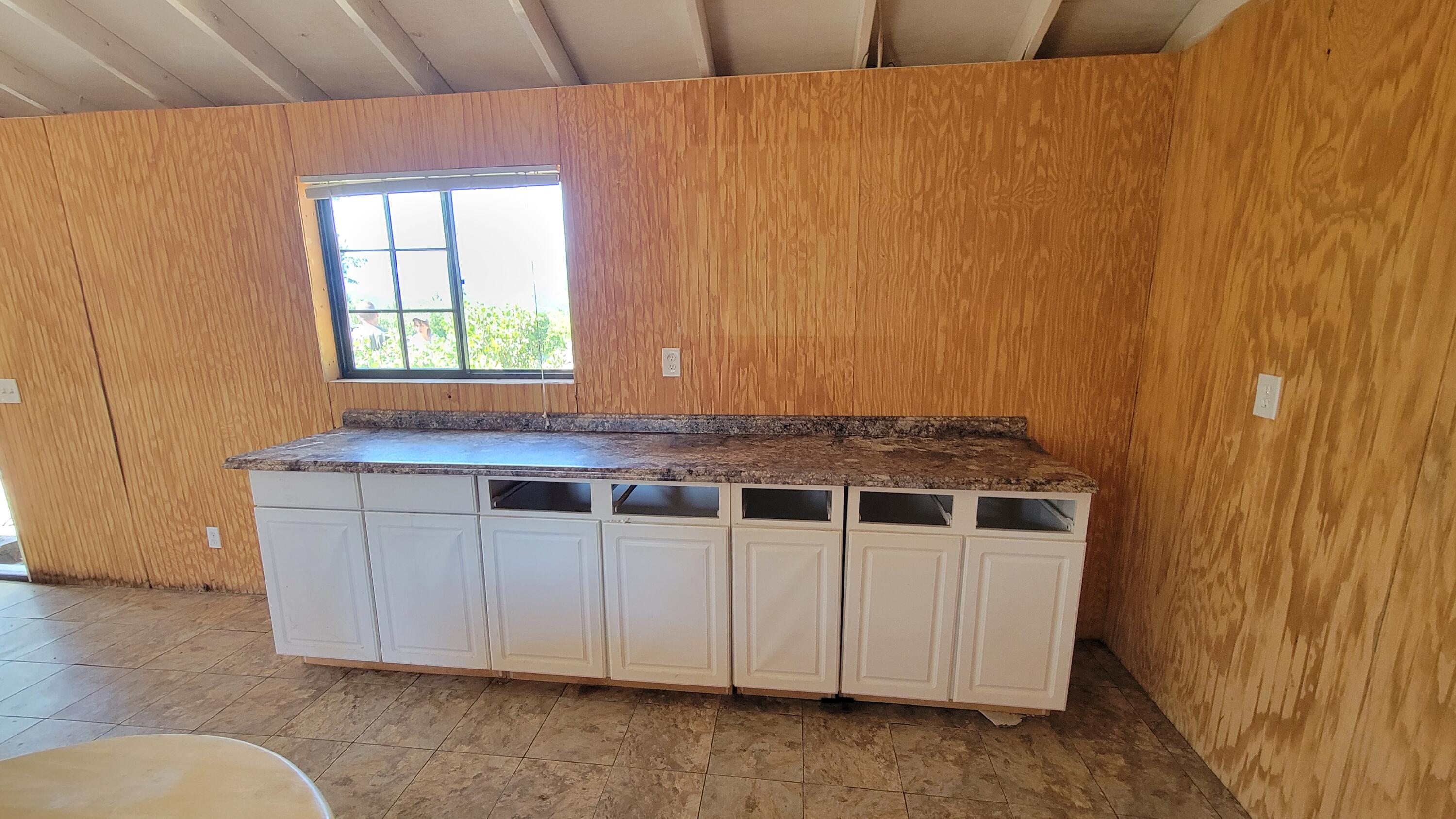 0 Backbone Road Bella Vista, CA 96008 - Photo 8 of 38 a view of a kitchen with granite countertop cabinets and window