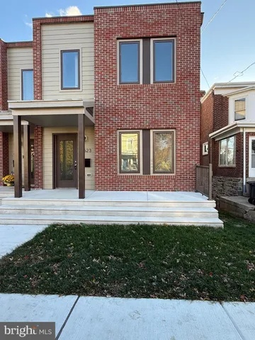 a view of house with yard