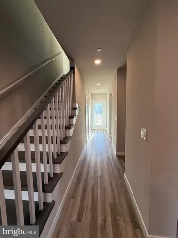 a view of entryway with wooden floor