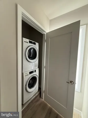 a utility room with sink dryer and washer