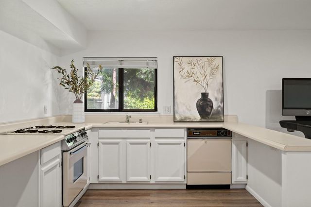 a view of balcony with furniture and trees