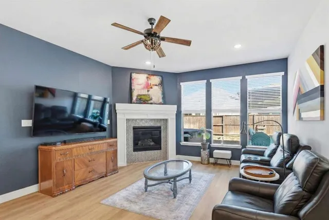 a living room with furniture or fireplace and a wooden floor