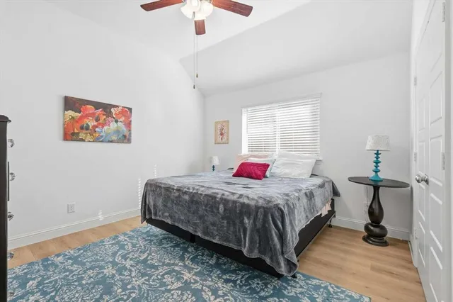 a bathroom with a tub a sink and a shower