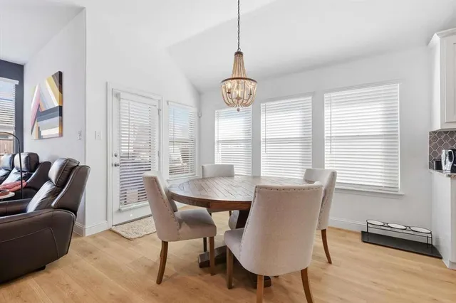 a living room with furniture flat screen tv and a fireplace