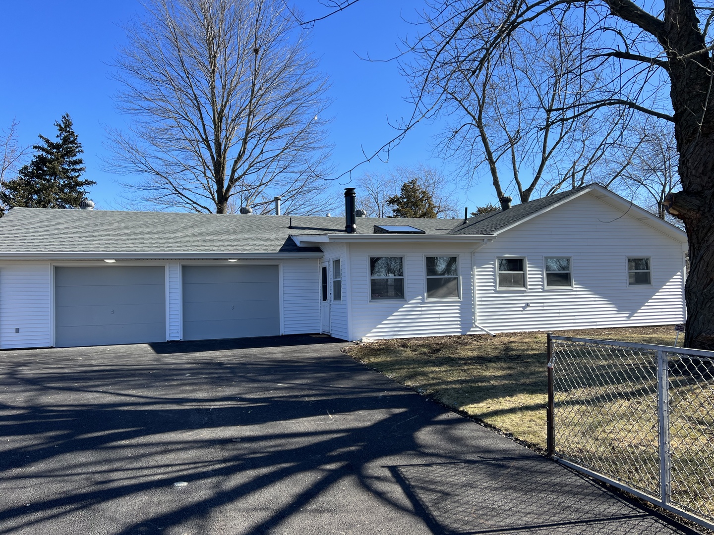 101 Louis Road Joliet, IL 60433 - Photo 1 of 17 a view of a house with a small yard and a large tree