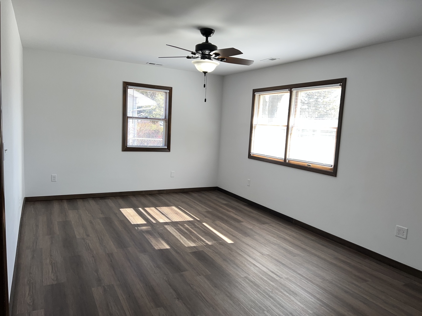 101 Louis Road Joliet, IL 60433 - Photo 10 of 17 a view of an empty room with wooden floor and a window