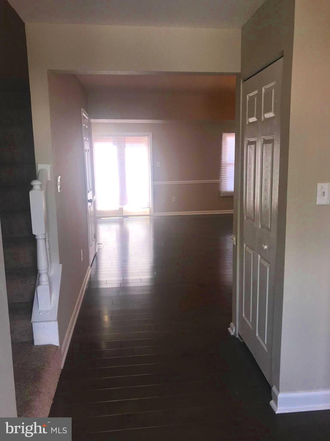 8657 Ritchboro Road District Heights, MD 20747 - Photo 2 of 23 a view of empty room with wooden floor