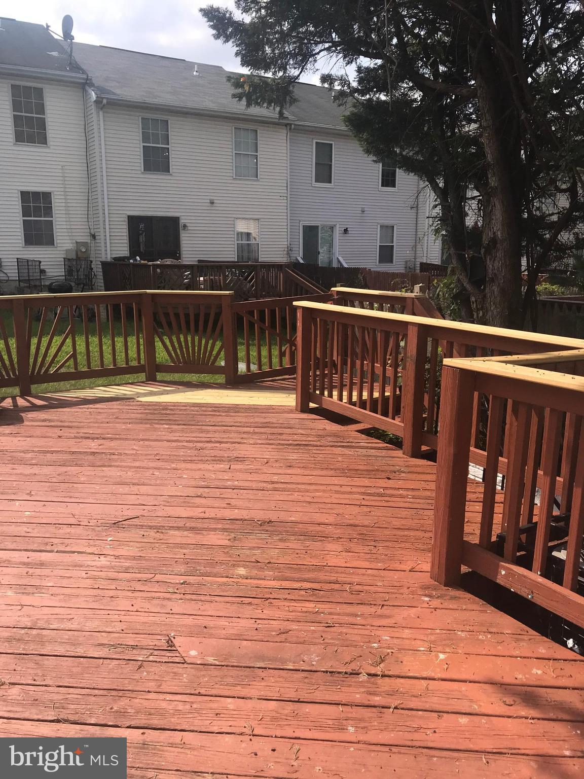 8657 Ritchboro Road District Heights, MD 20747 - Photo 11 of 23 a view of a house with wooden deck