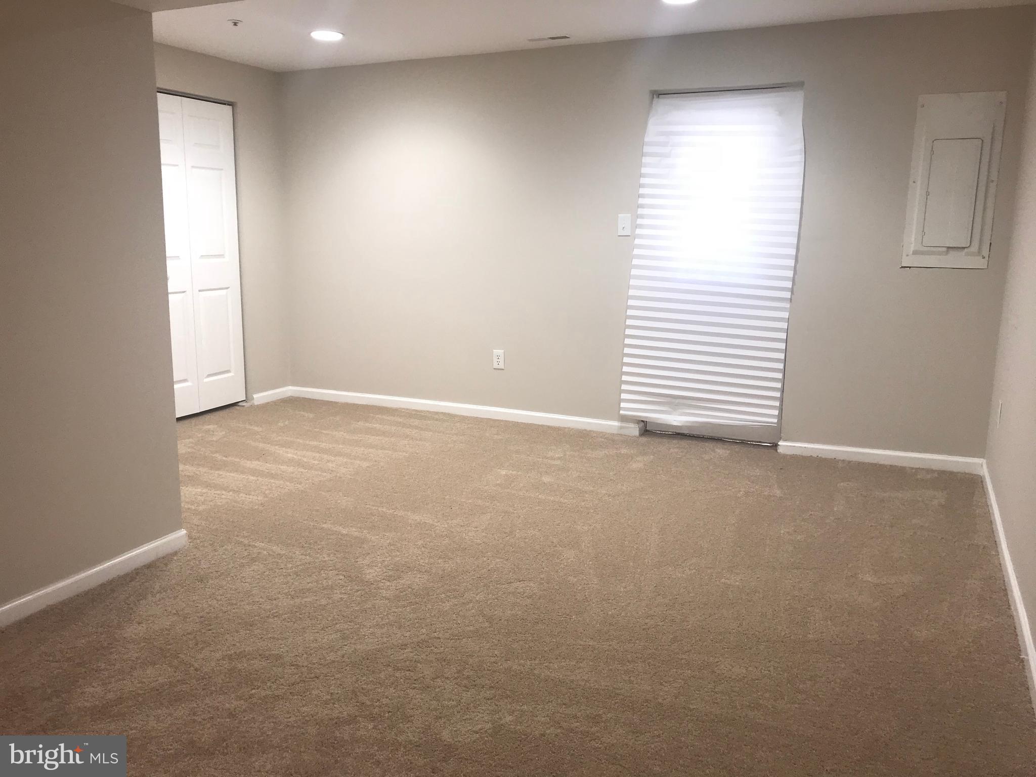 8657 Ritchboro Road District Heights, MD 20747 - Photo 12 of 23 an empty room with a window
