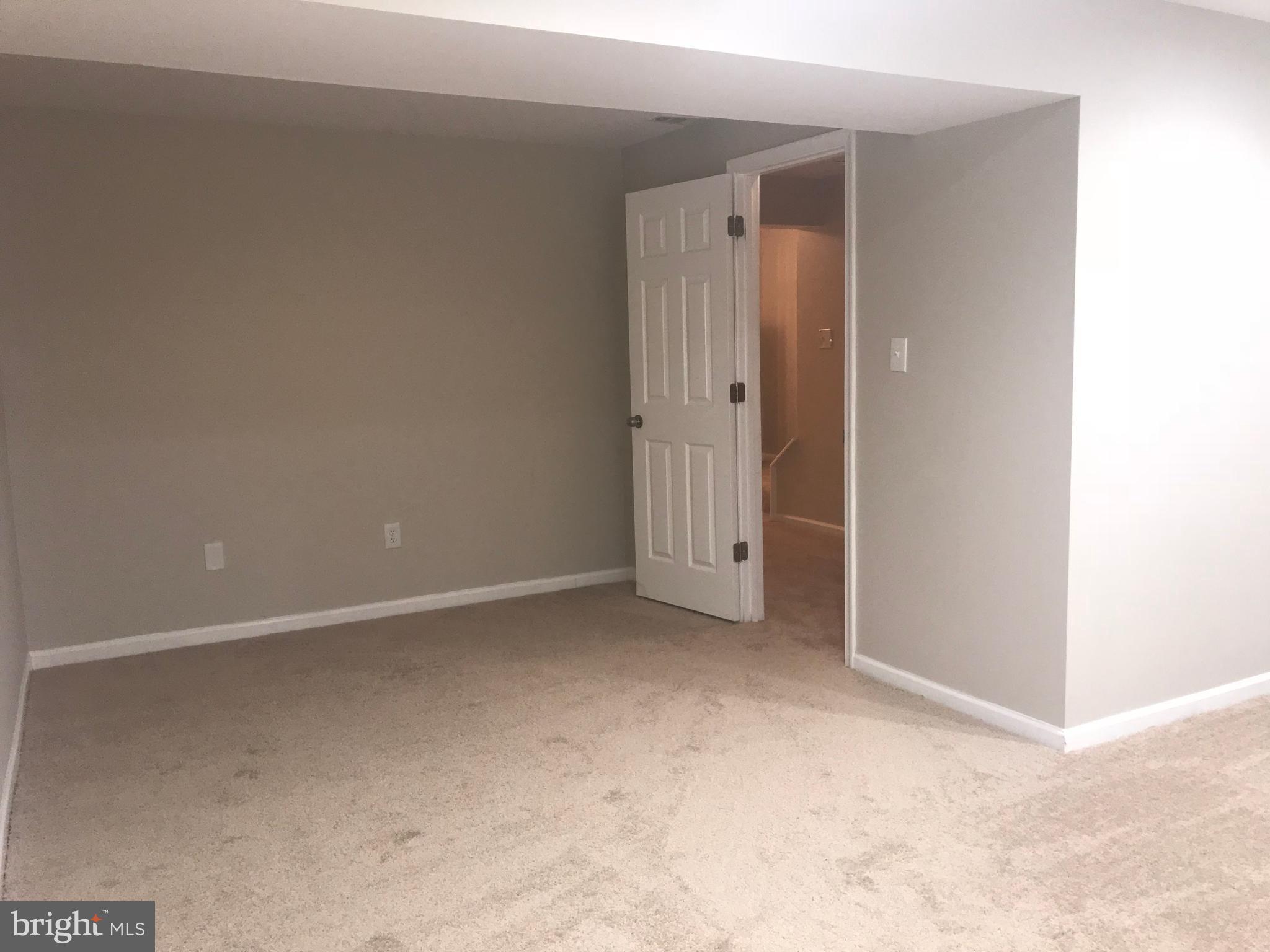 8657 Ritchboro Road District Heights, MD 20747 - Photo 13 of 23 a view of an empty room