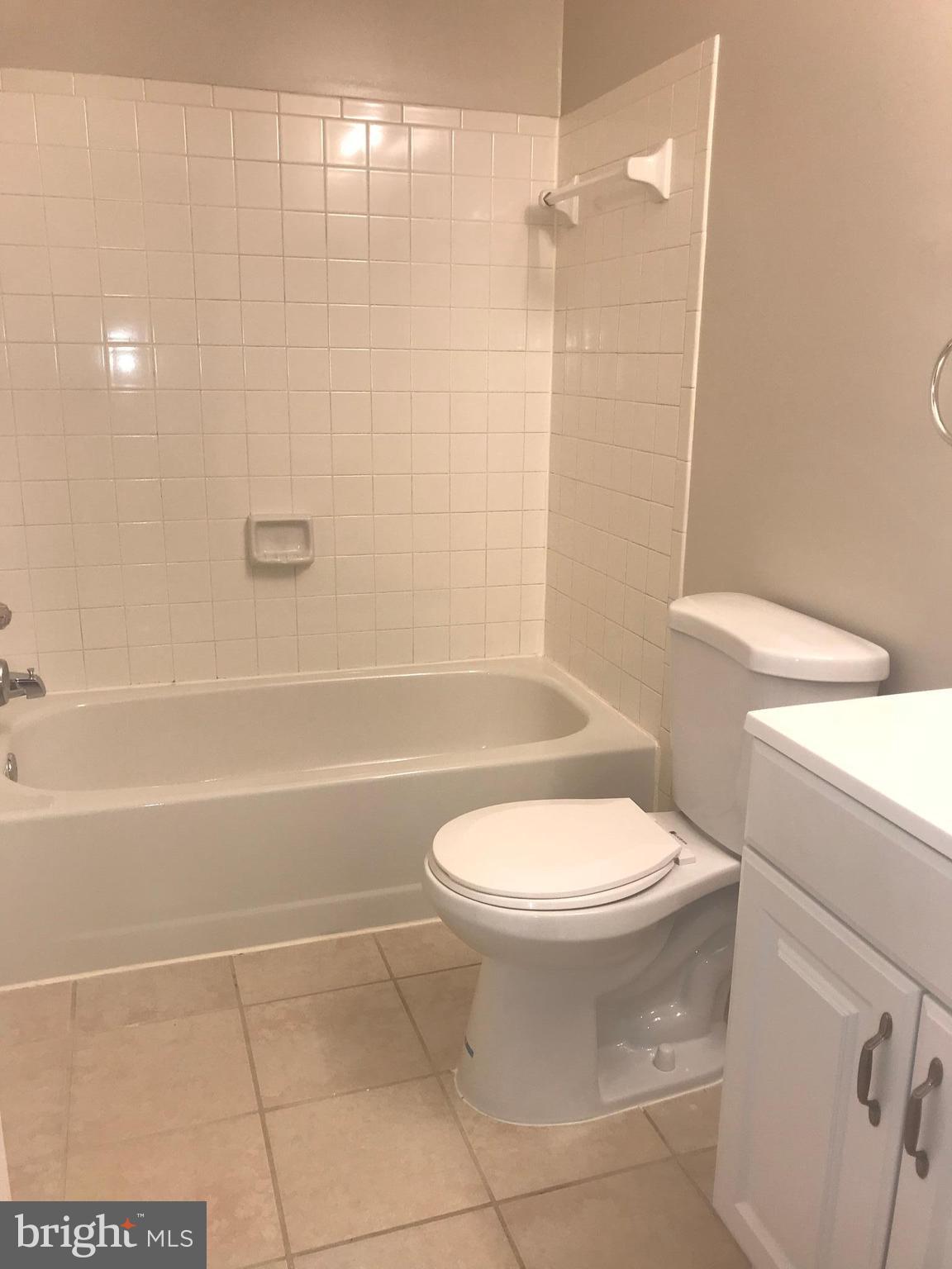 8657 Ritchboro Road District Heights, MD 20747 - Photo 14 of 23 a bathroom with a toilet and a shower