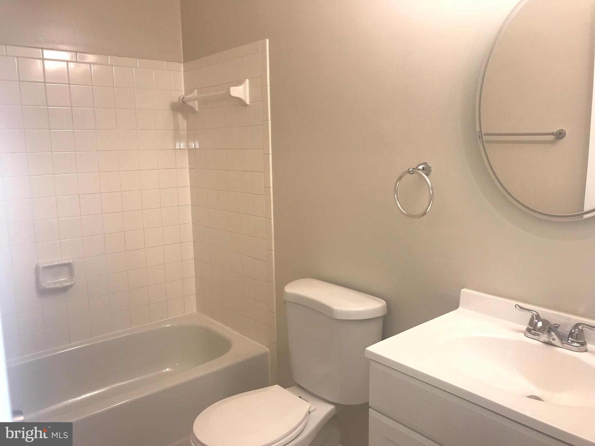 8657 Ritchboro Road District Heights, MD 20747 - Photo 15 of 23 a bathroom with a toilet and a bathtub