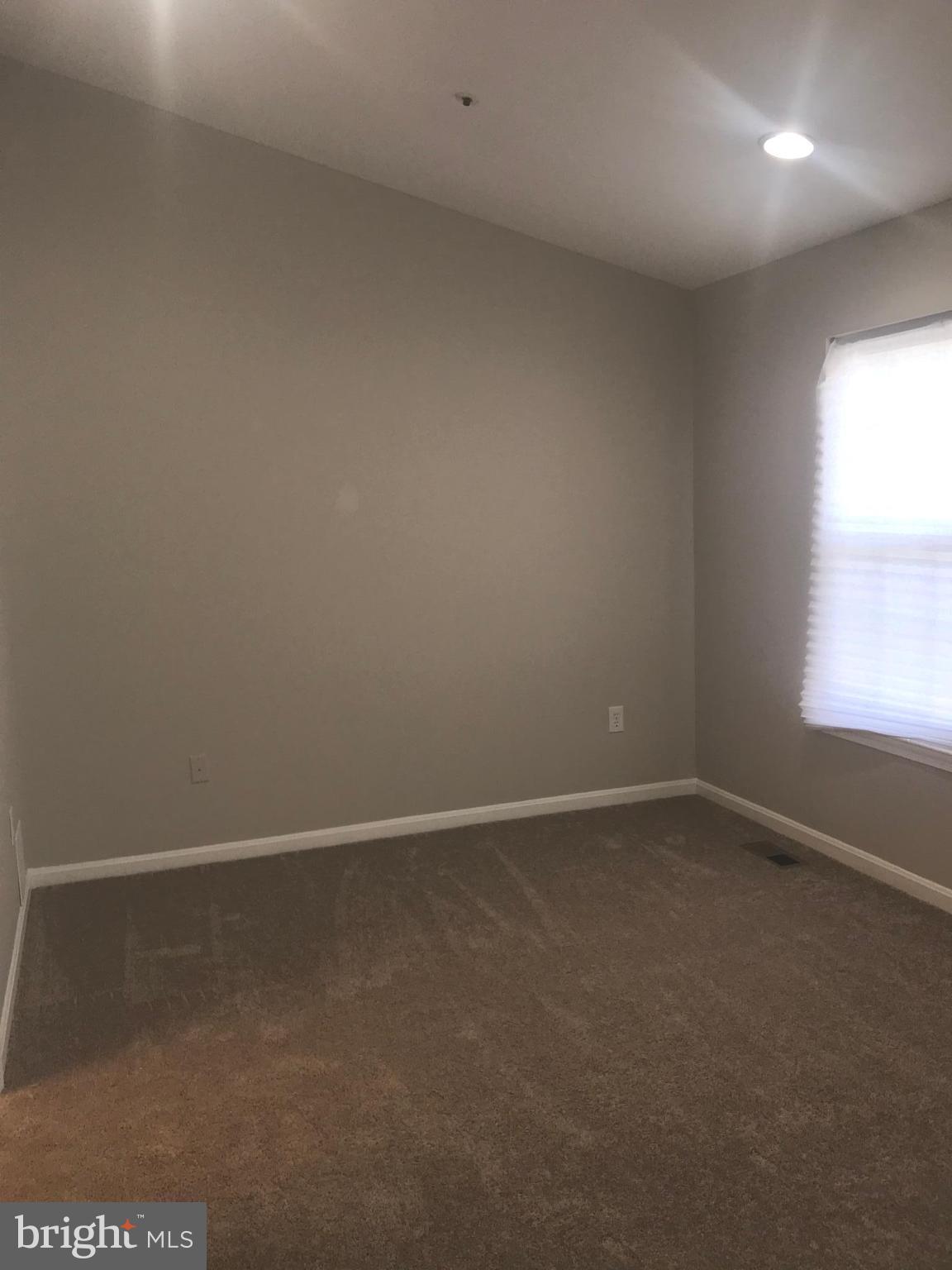 8657 Ritchboro Road District Heights, MD 20747 - Photo 19 of 23 an empty room with a window