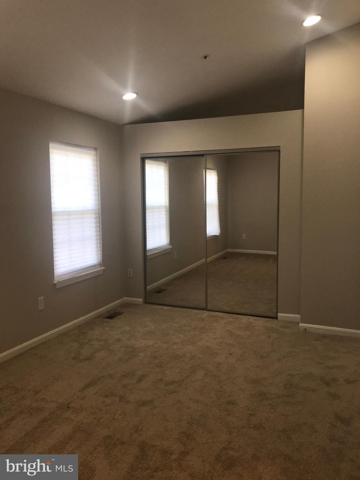 8657 Ritchboro Road District Heights, MD 20747 - Photo 20 of 23 an empty room with an empty space and windows