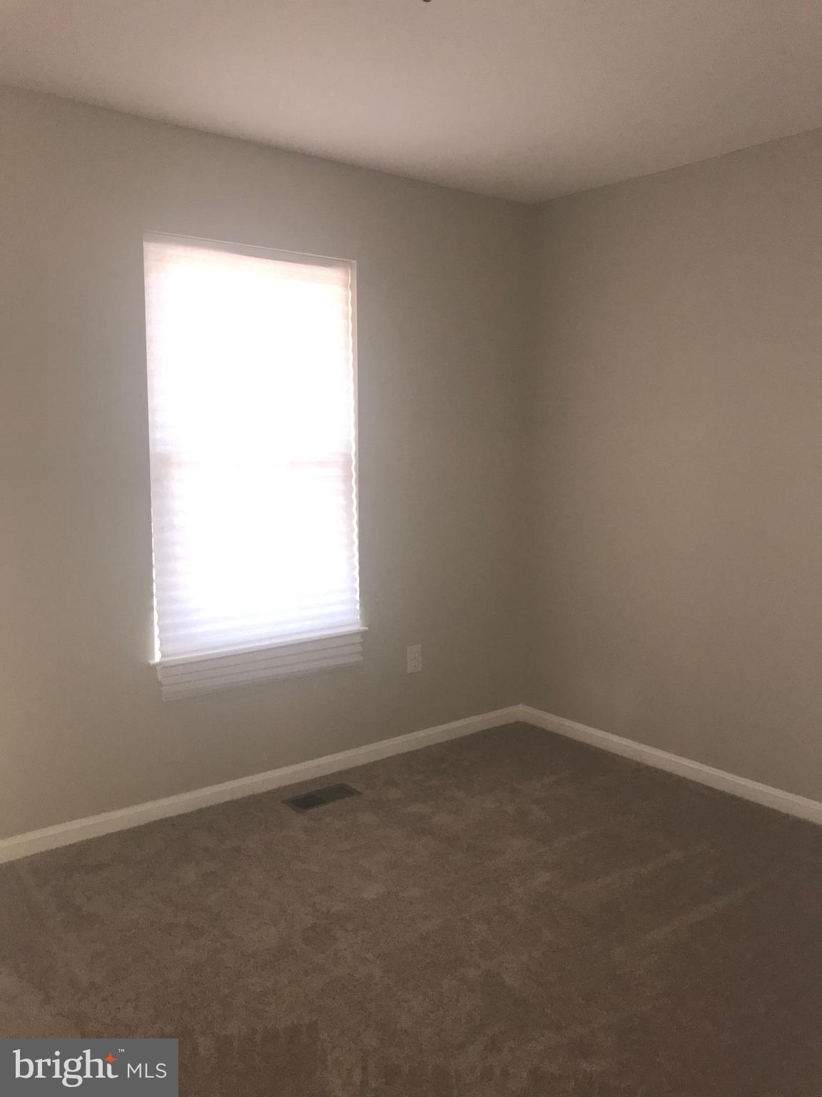 8657 Ritchboro Road District Heights, MD 20747 - Photo 22 of 23 an empty room with a window