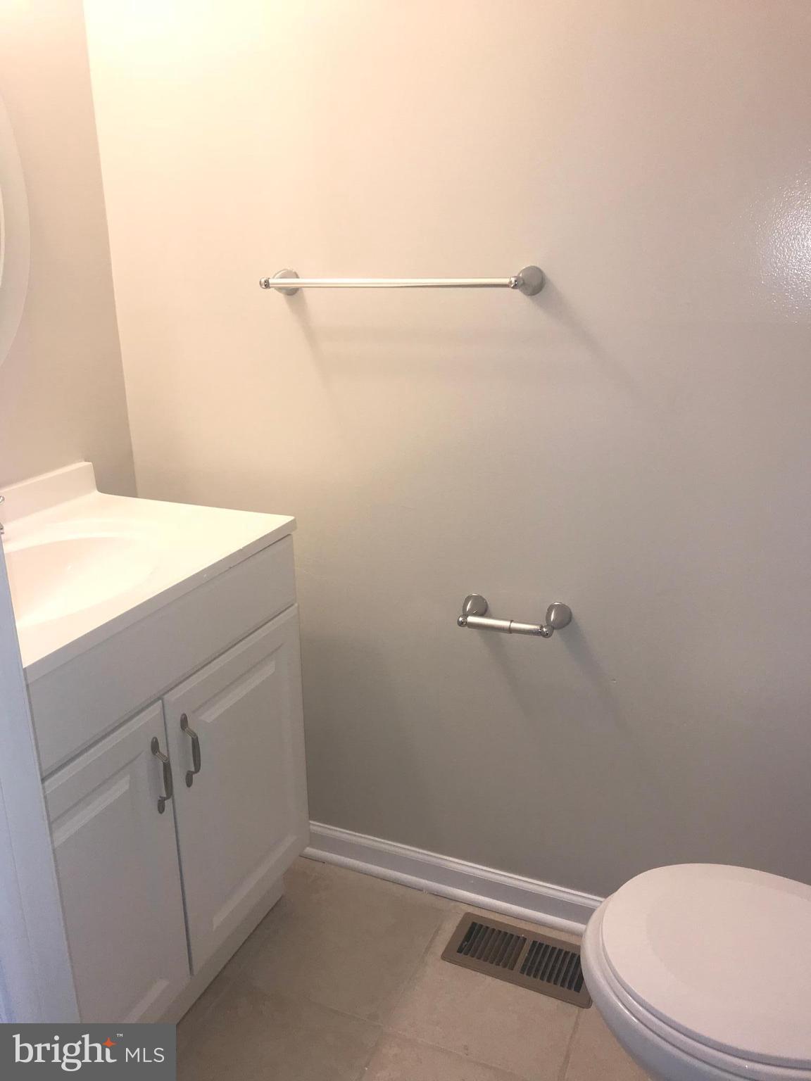 8657 Ritchboro Road District Heights, MD 20747 - Photo 23 of 23 a bathroom with a sink a toilet and vanity