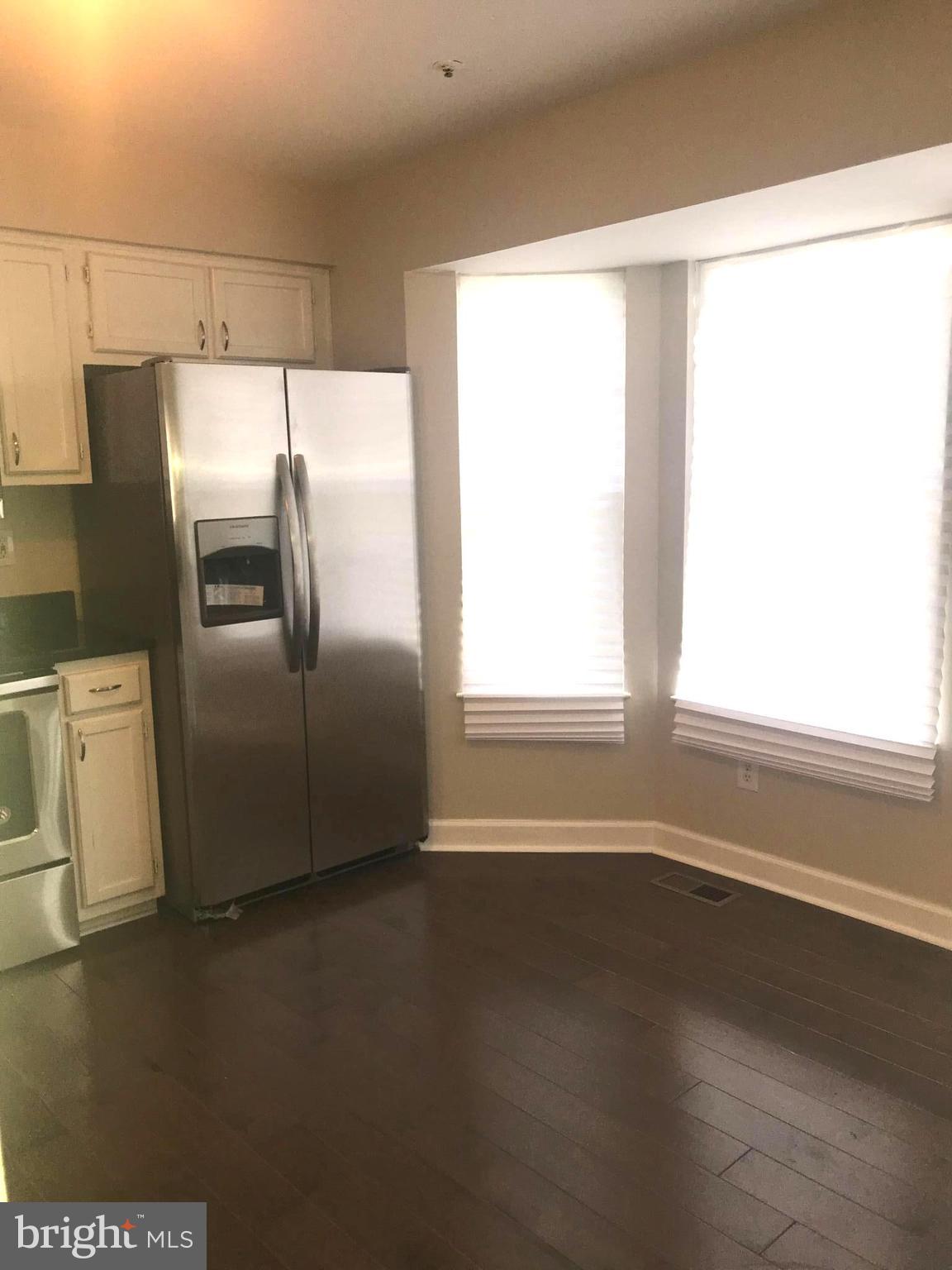 8657 Ritchboro Road District Heights, MD 20747 - Photo 6 of 23 a view of a refrigerator in kitchen and a window