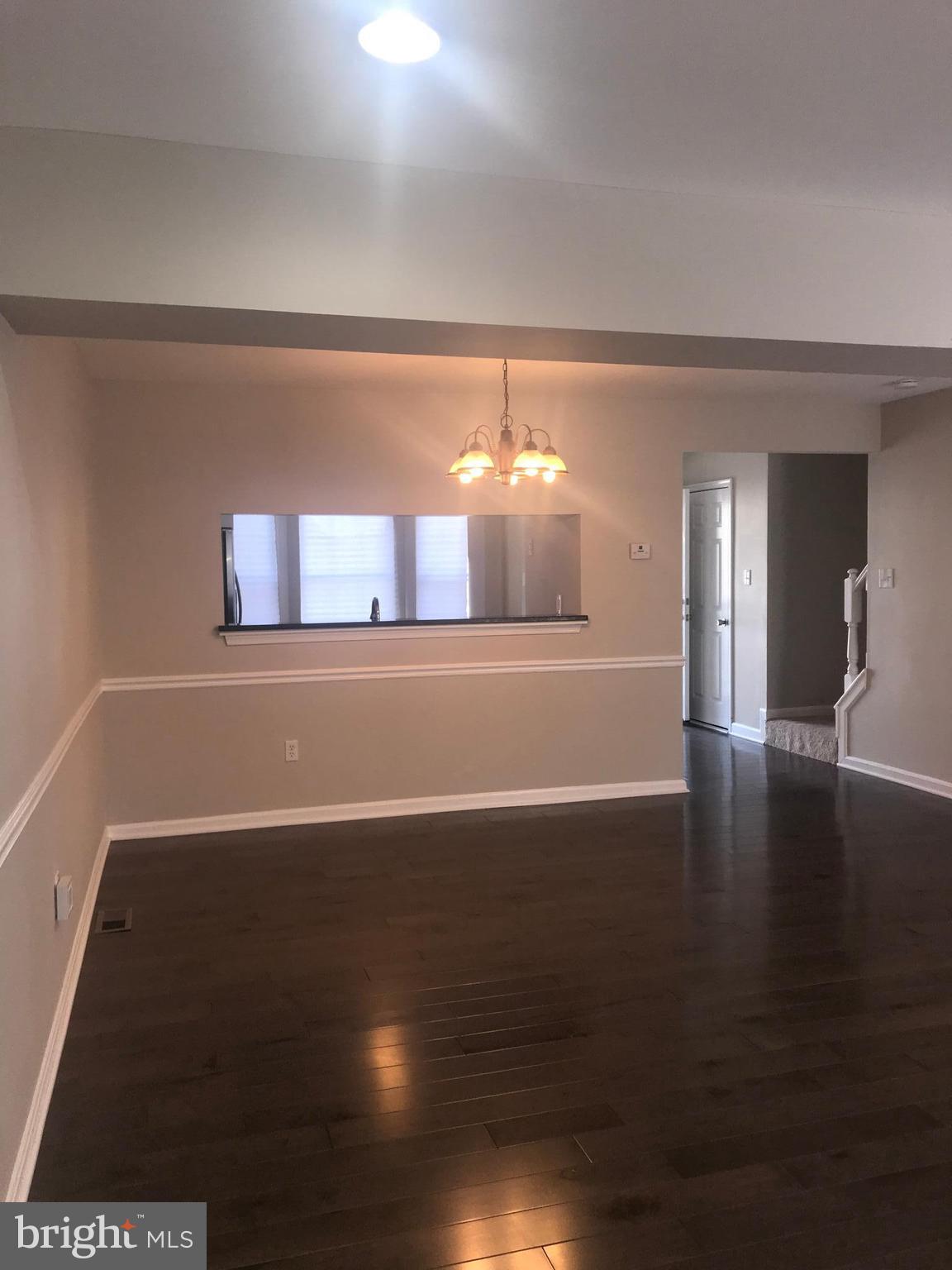 8657 Ritchboro Road District Heights, MD 20747 - Photo 9 of 23 a view of a room with wooden floor