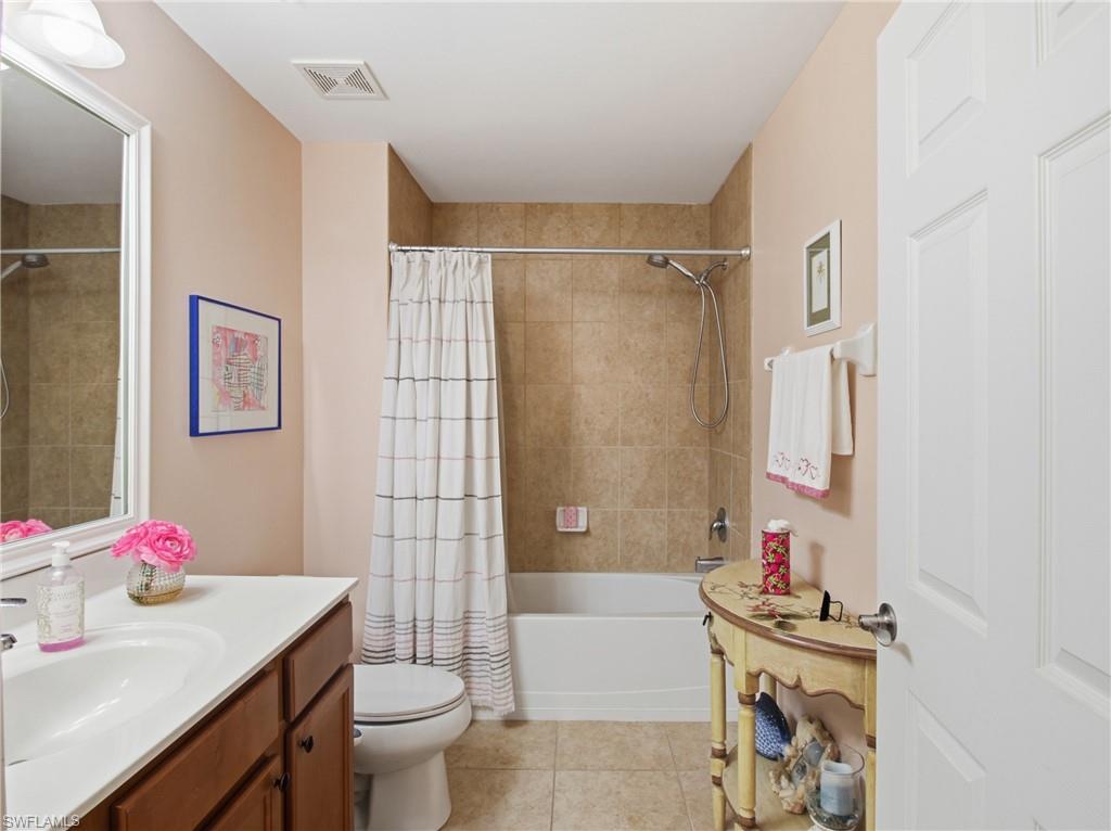 20161 Bravada Street, Unit 2 Estero, FL 33928 - Photo 21 of 33 a bathroom with a sink toilet and shower