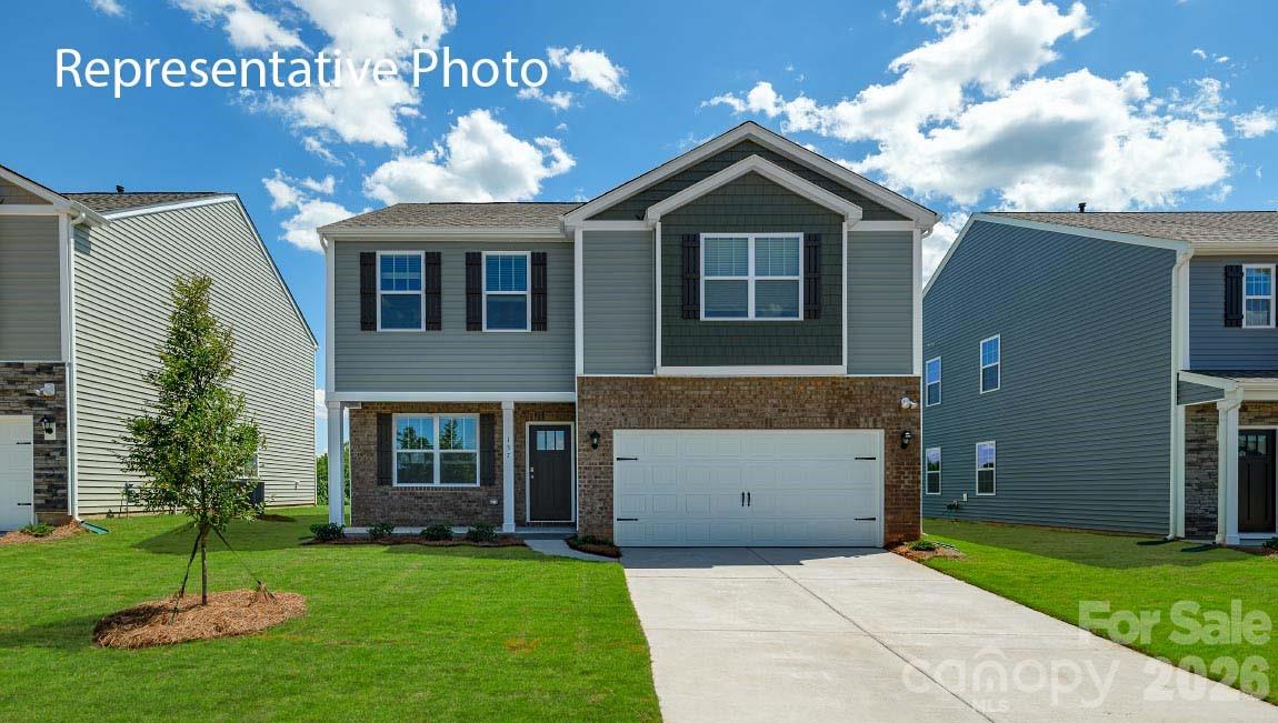602 Dazzle Loop Newton, NC 28658 - Photo 1 of 29 a front view of a house with a yard and garage