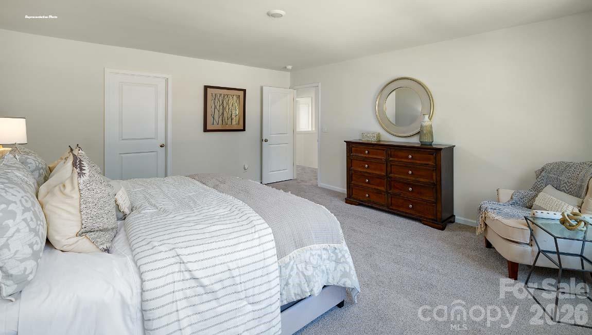 602 Dazzle Loop Newton, NC 28658 - Photo 13 of 29 a bedroom with a bed and furniture