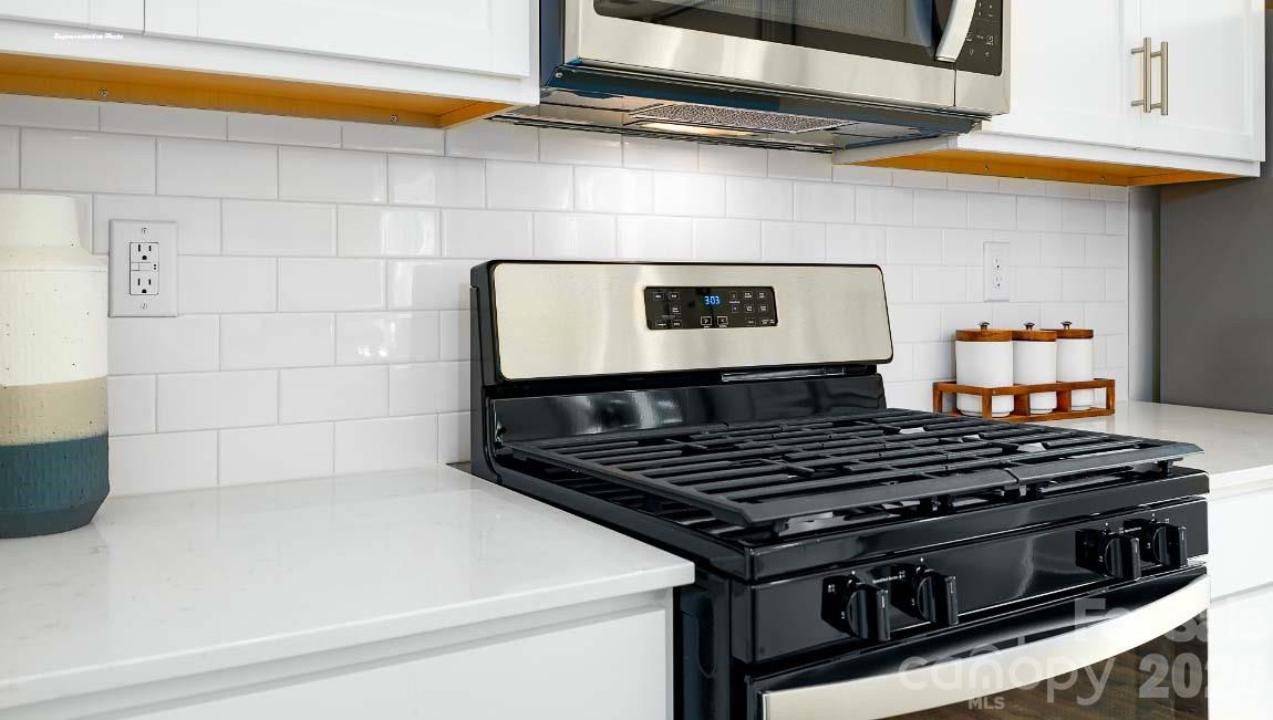 602 Dazzle Loop Newton, NC 28658 - Photo 8 of 29 a stove top oven sitting inside of a kitchen