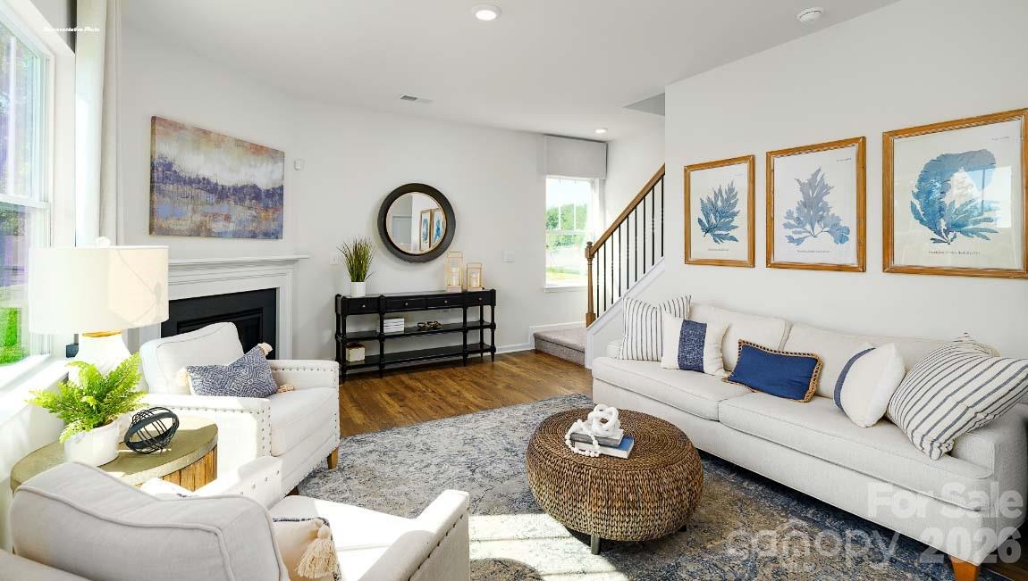 602 Dazzle Loop Newton, NC 28658 - Photo 10 of 29 a living room with furniture a couch and wall paintings