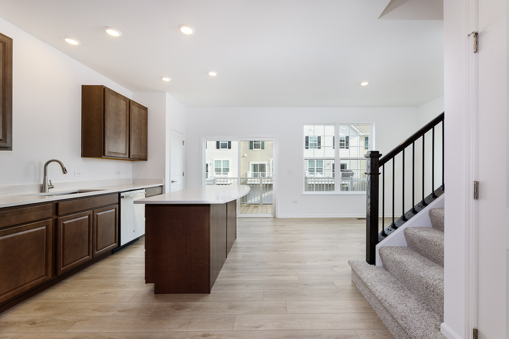 1703 Neubauer Circle Lindenhurst, IL 60046 - Photo 11 of 37 a large kitchen with stainless steel appliances granite countertop a large counter top and a wooden floors