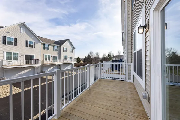 a view of a house with wooden deck